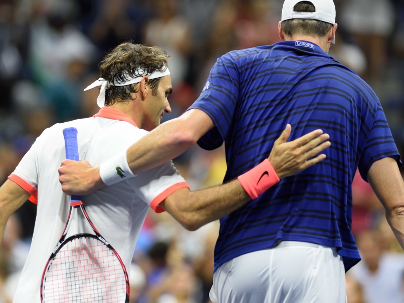 Federer Solves Isner's Serve, Finally, and Advances