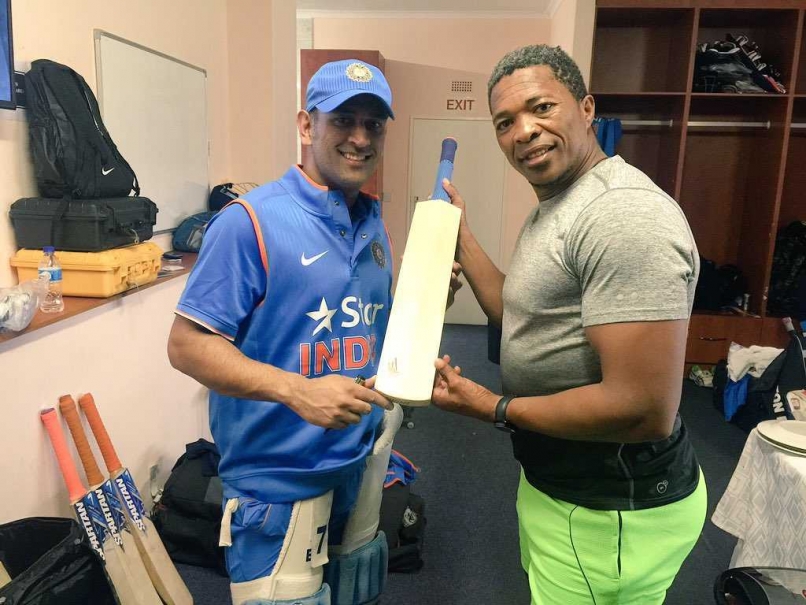 MS Dhoni Gifts Makhaya Ntini Autographed Bat