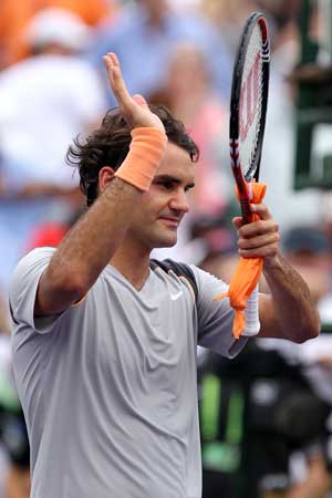 Federer holds off Monaco in Miami