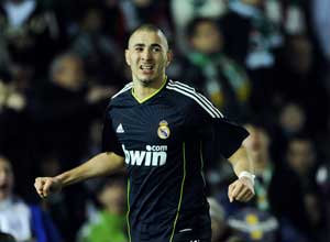 Real close gap as in-form Benzema downs Racing