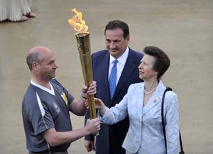 Greece hands Olympic flame over to Britain