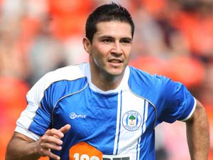 Wigan's Alcaraz hit with spitting charge