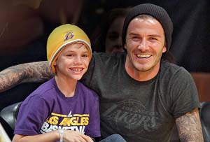 David Beckham and kids meet One Direction at concert