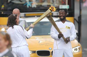Black Eyed Peas will.i.am carries Olympic torch