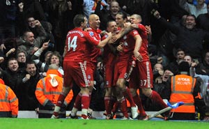Carroll the hero as 10-man Reds sink Rovers