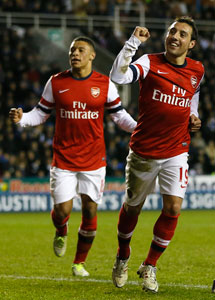 Cazorla treble lifts Arsenal gloom in Reading rout