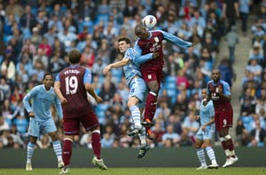 Manchester City go top after routing Villa