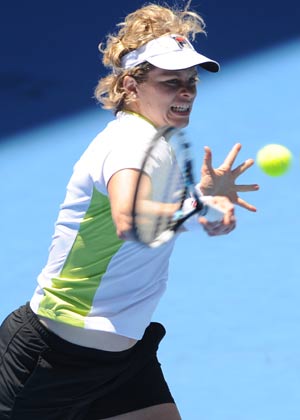 Defending champion Clijsters sails into round two
