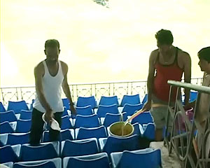 Footballers clean cricket stadium to replace torn shoes