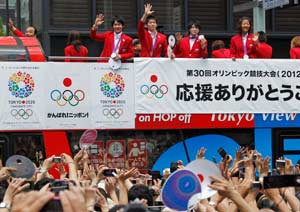 Olympics: Japanese medalists return to rousing celebration
