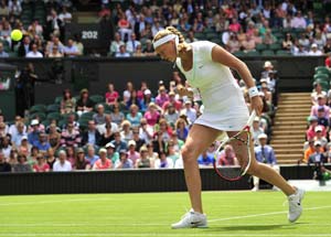 Champion Kvitova struggles into Wimbledon second round
