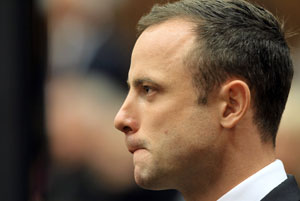 Prosecutor hammers away as Oscar Pistorius resumes testimony
