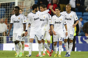 Real Madrid hit Malaga for six, delay Barca title party