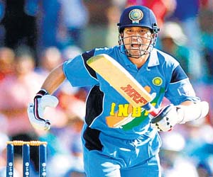 Modi donates Tendulkar's jersey for girl child education