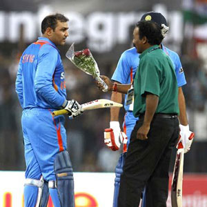 Sehwag's rare dive and a bouquet