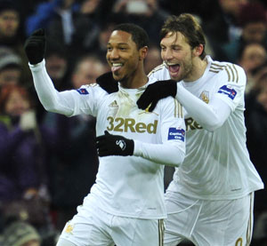 Swansea crush Bradford 5-0 to claim League Cup crown