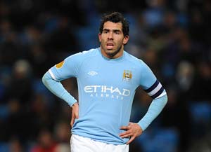 Carlos Tevez takes a dig at Gary Neville for juggling roles