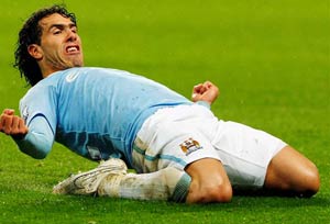 Guilty Tevez back at City, faces record fine