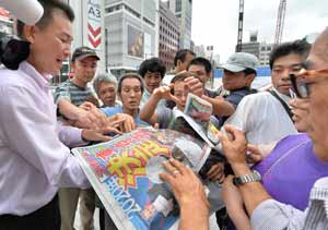 Amid hopes of Olympic renewal, economic and safety tests for Tokyo